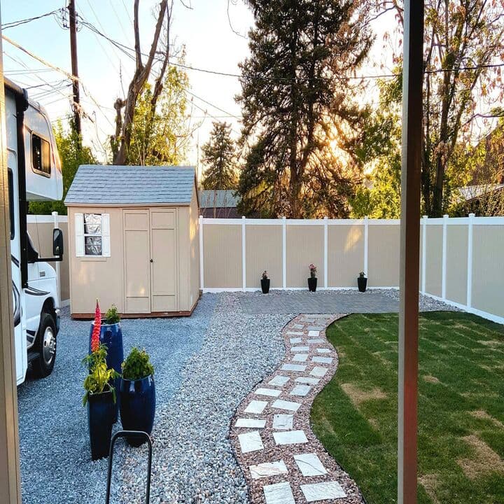 Gravel yard renovation with stone pathway and RV parking pad