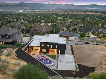 Aerial daytime view of a backyard overlooking the valley