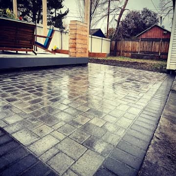 Landscaped walkway with turf and boxwood planters