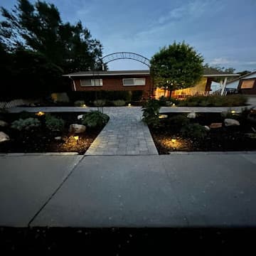 Finished paver patio with wood fence backdrop